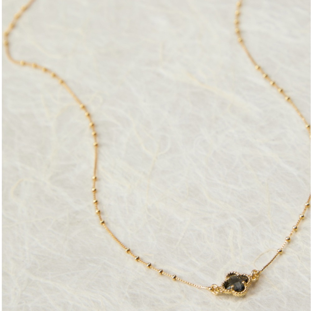 Elegant Gold Necklace with Black Gemstone